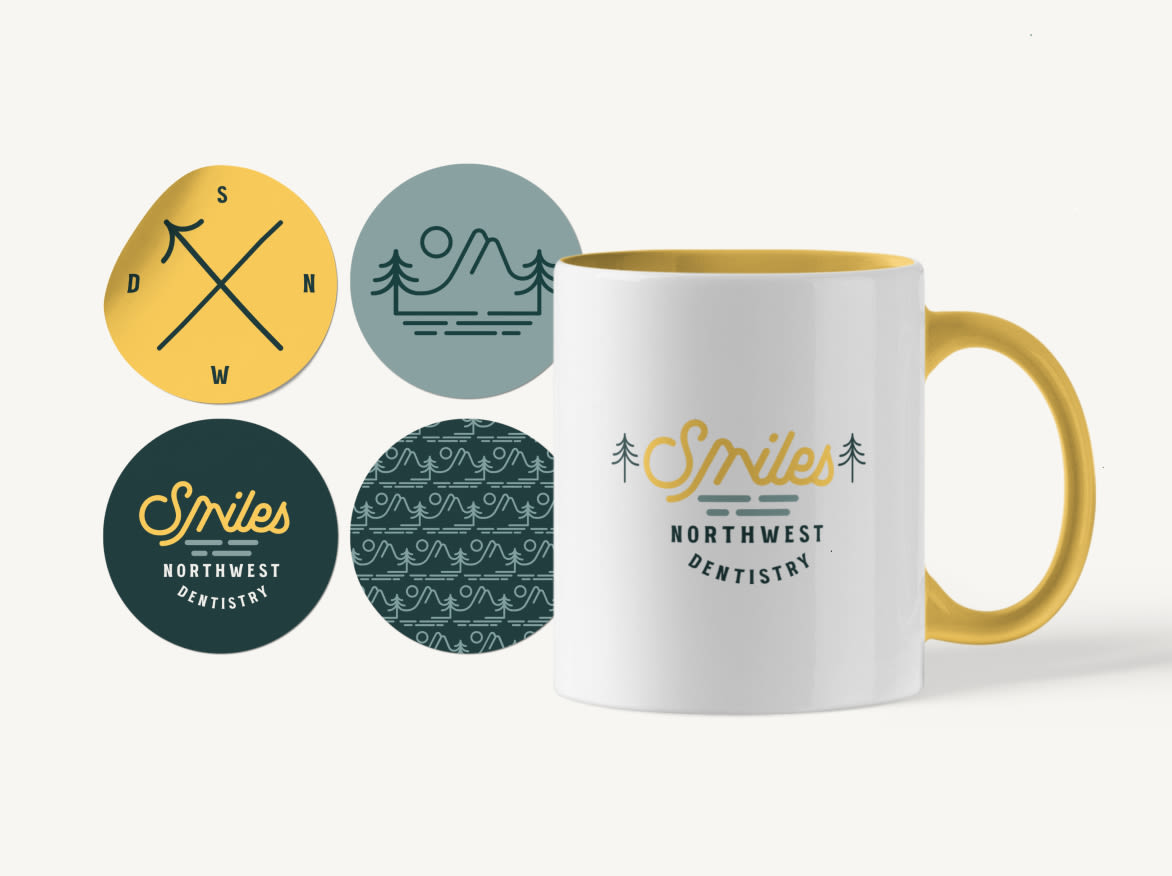 Logo variations on a mug and stickers created in a Studio 1-to-1 project for Smiles Northwest Dentistry