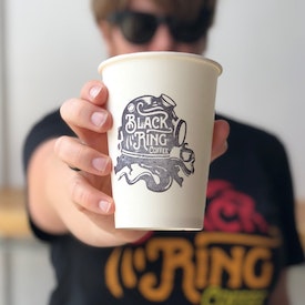coffee cup with black logo design